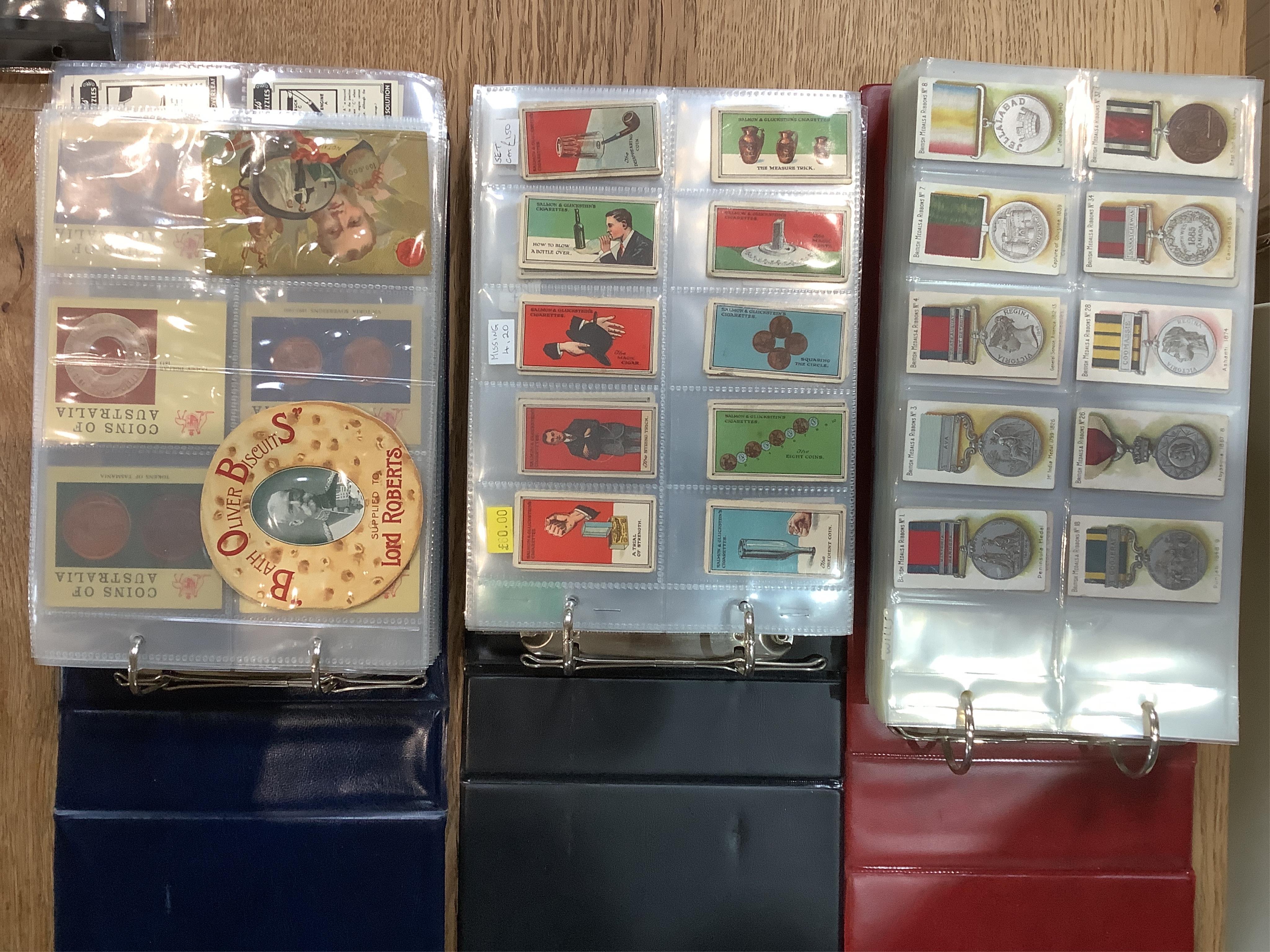 Six albums of assorted cigarette cards; Military Uniform, Medals, Heroes, Magic tricks and Coins. Condition - overall good